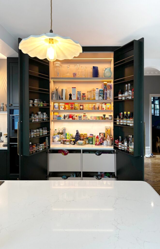 Full-height pantry cabinetry with illuminated shelving in the Kensal Rise kitchen renovation