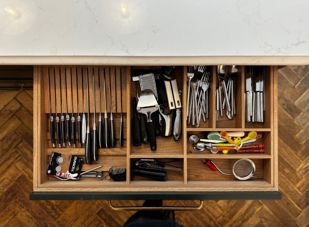 Organised cutlery drawer with bespoke internal storage in the Kensal Rise kitchen renovation