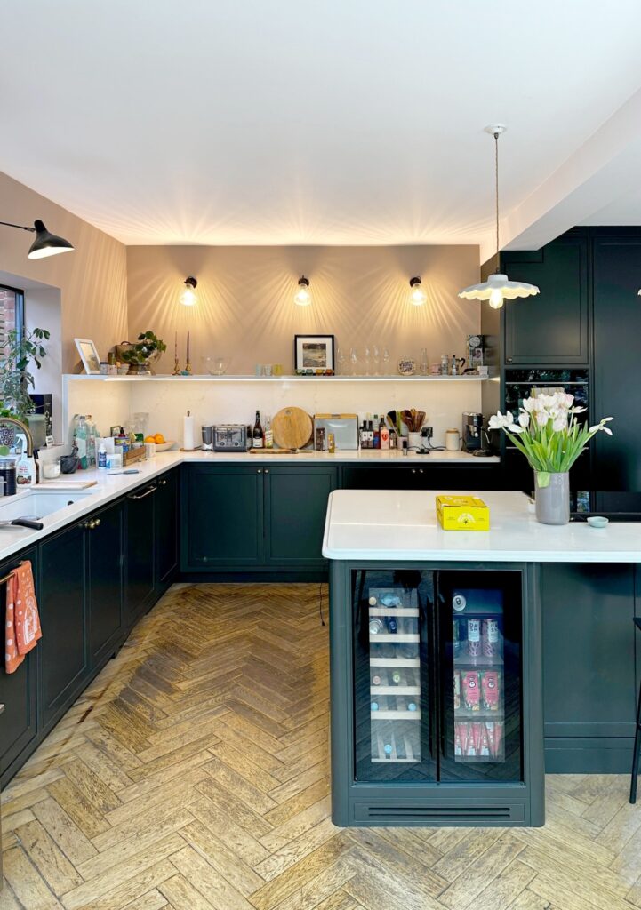 Completed kitchen renovation with dark cabinetry, island and new lighting in Kensal Rise NW6