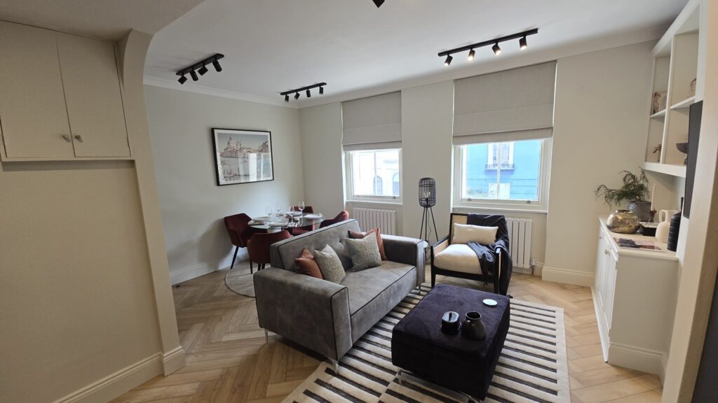 Refurbished living and dining room with herringbone flooring in Paddington, London W2